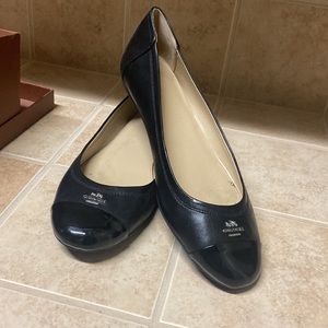 Coach black flats. Worn once and found out they were too small.  Very cute!!!